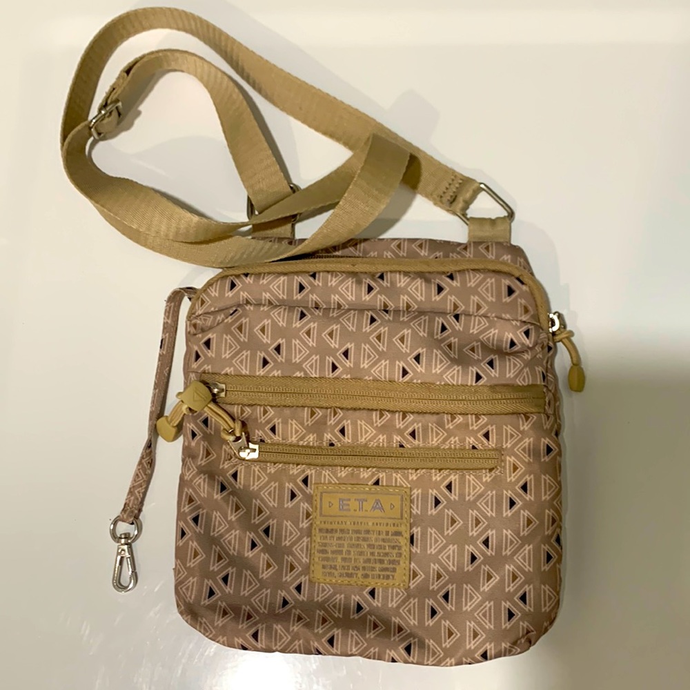 E.T.A crossbody travel bag.